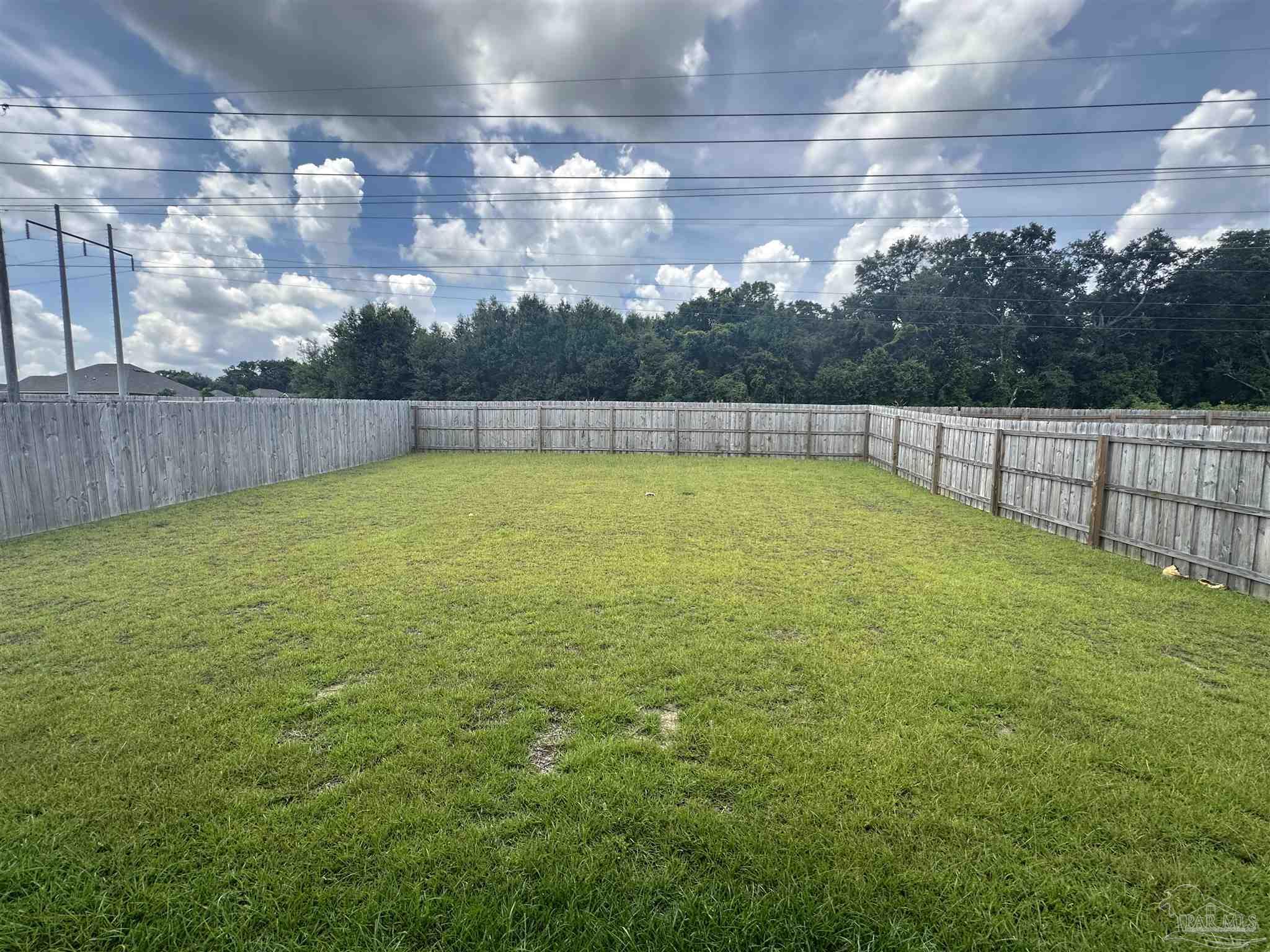 4753 Sago Palm Circle Pace, FL 32571 - Photo 24 of 24 a view of a outdoor space with lots of green space