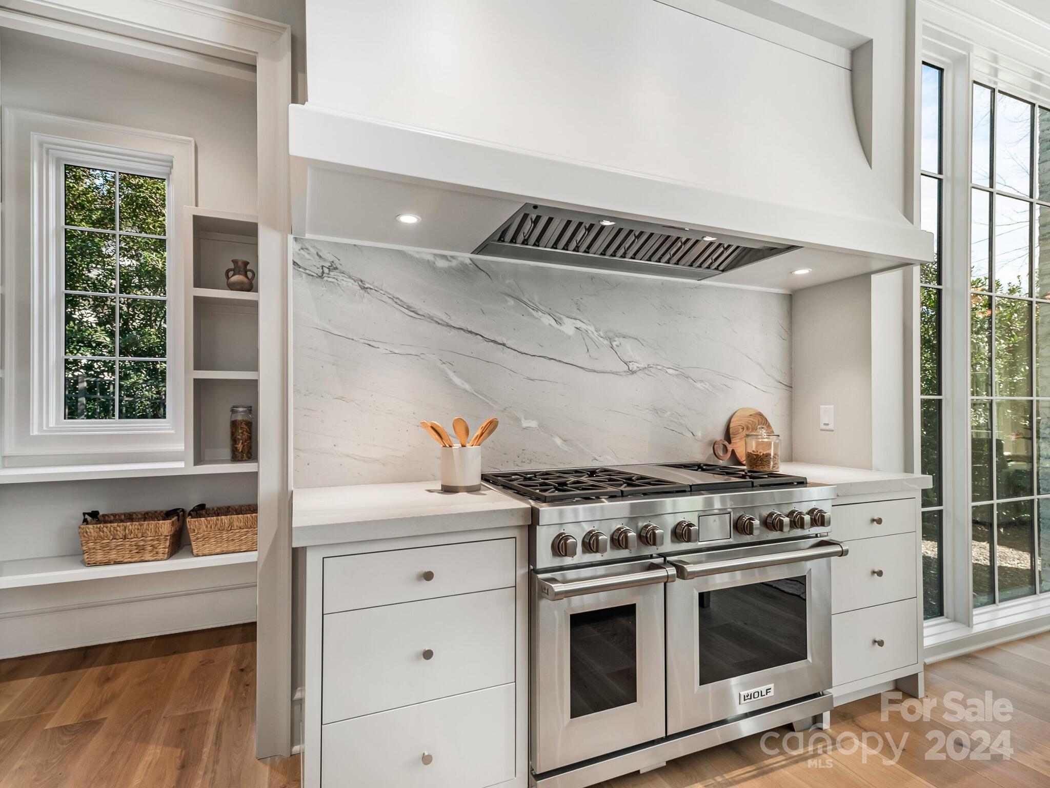 2215 Ferncliff Road Charlotte, NC 28211 - Photo 12 of 46 a kitchen with stainless steel appliances a stove a sink and a cabinets