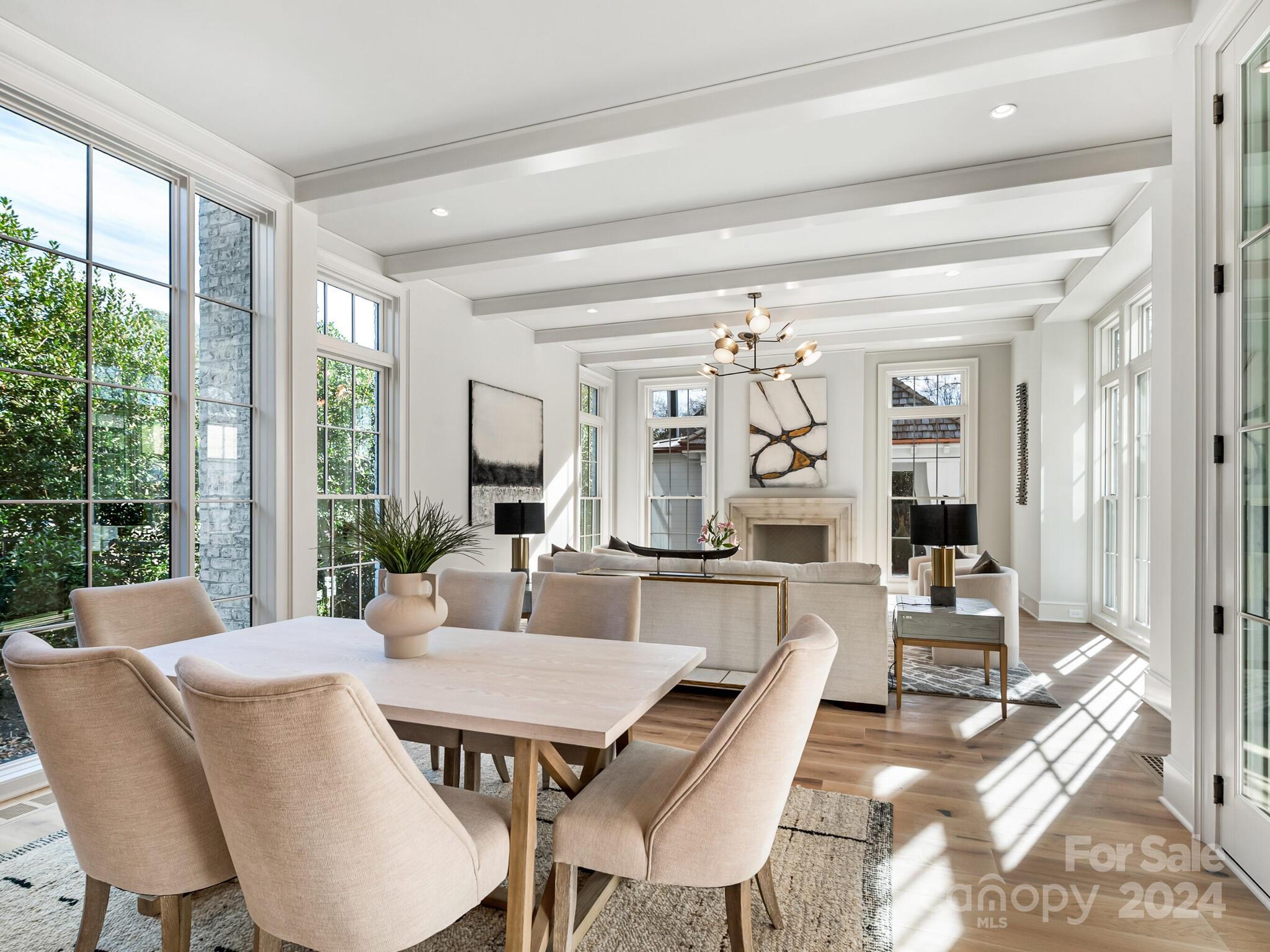 2215 Ferncliff Road Charlotte, NC 28211 - Photo 16 of 46 a dining room with furniture and wooden floor
