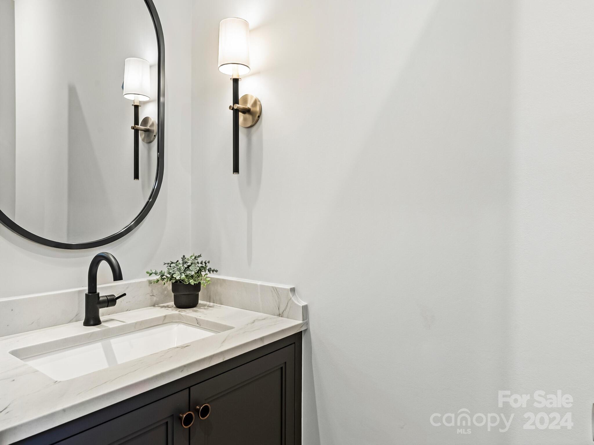 2215 Ferncliff Road Charlotte, NC 28211 - Photo 20 of 46 a bathroom with a sink and mirror