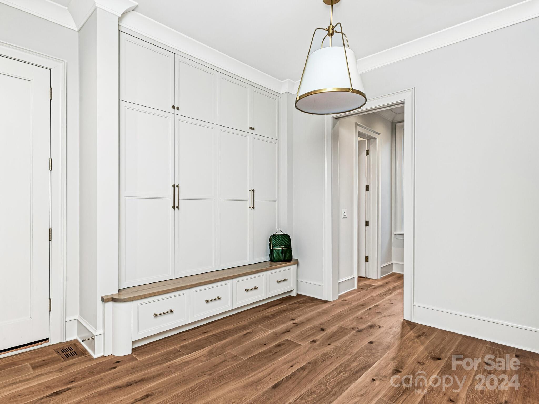 2215 Ferncliff Road Charlotte, NC 28211 - Photo 21 of 46 a view of a room with wooden floor and ceiling fan