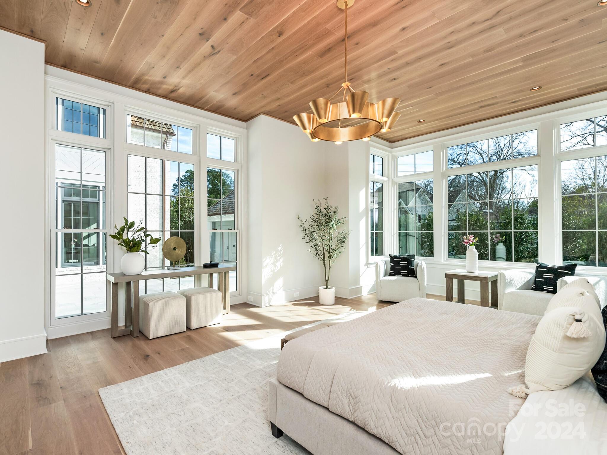 2215 Ferncliff Road Charlotte, NC 28211 - Photo 23 of 46 a bed sitting in a spacious bedroom next to a large window