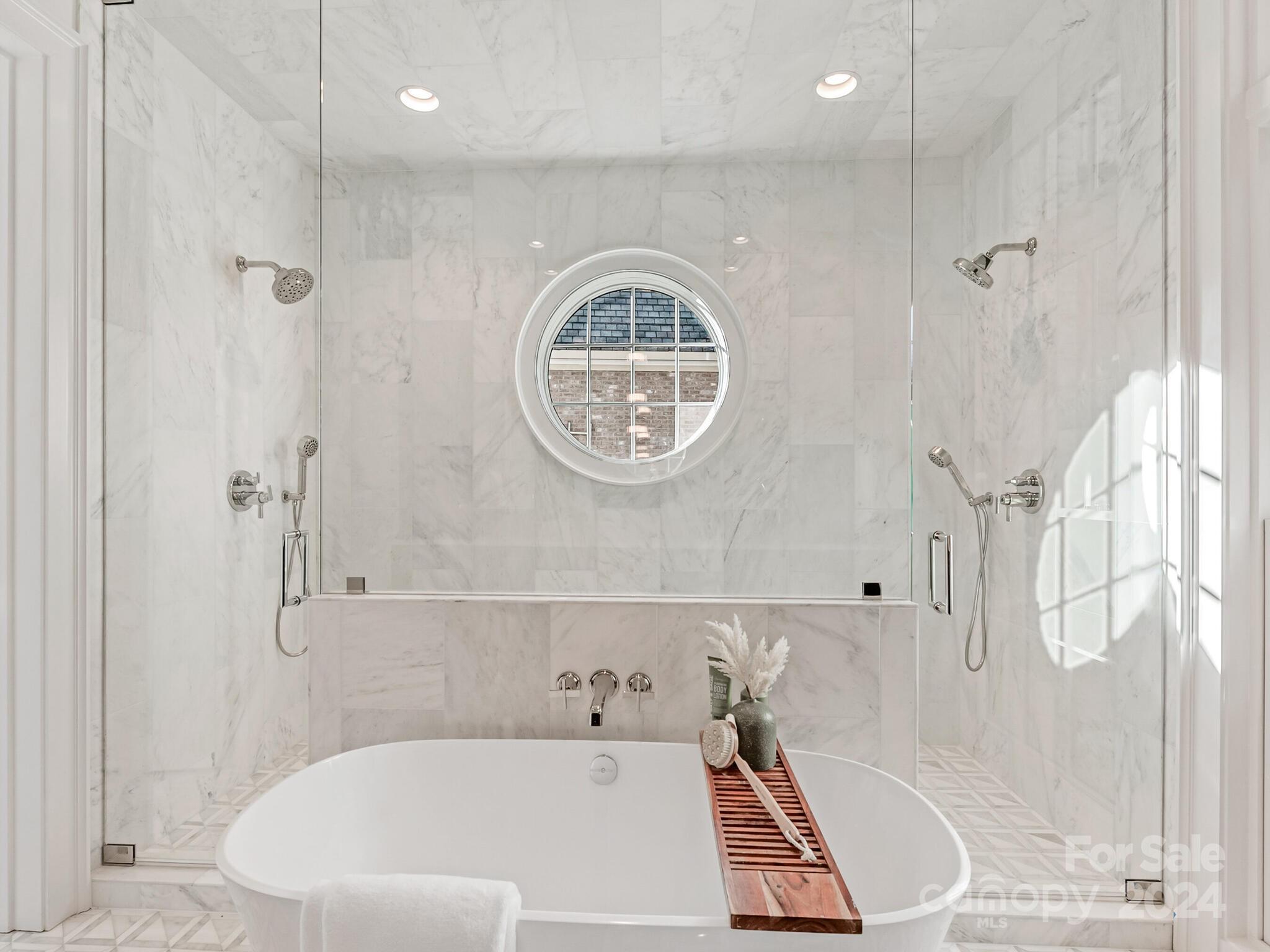 2215 Ferncliff Road Charlotte, NC 28211 - Photo 26 of 46 a bathroom with a bathtub and a shower