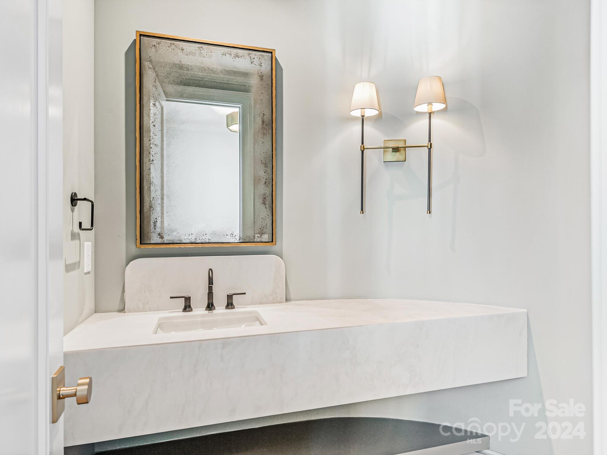 2215 Ferncliff Road Charlotte, NC 28211 - Photo 29 of 46 a bathroom with a sink and a mirror