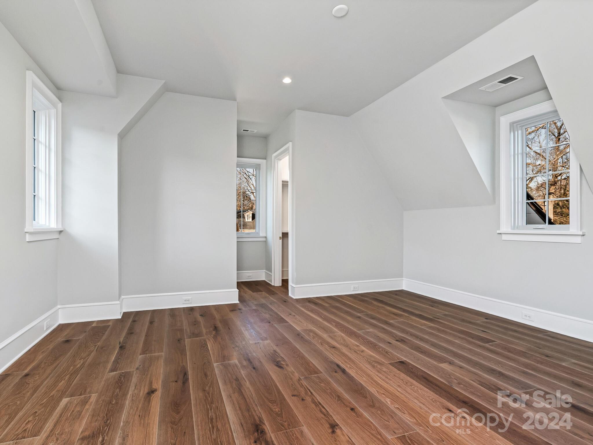 2215 Ferncliff Road Charlotte, NC 28211 - Photo 33 of 46 wooden floor in an empty room with a window