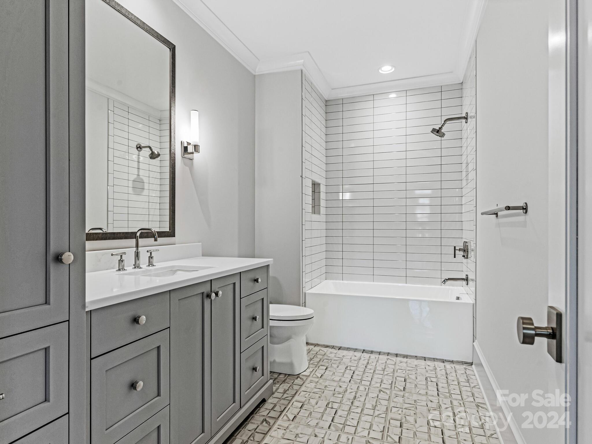 2215 Ferncliff Road Charlotte, NC 28211 - Photo 34 of 46 a bathroom with a sink a toilet and shower