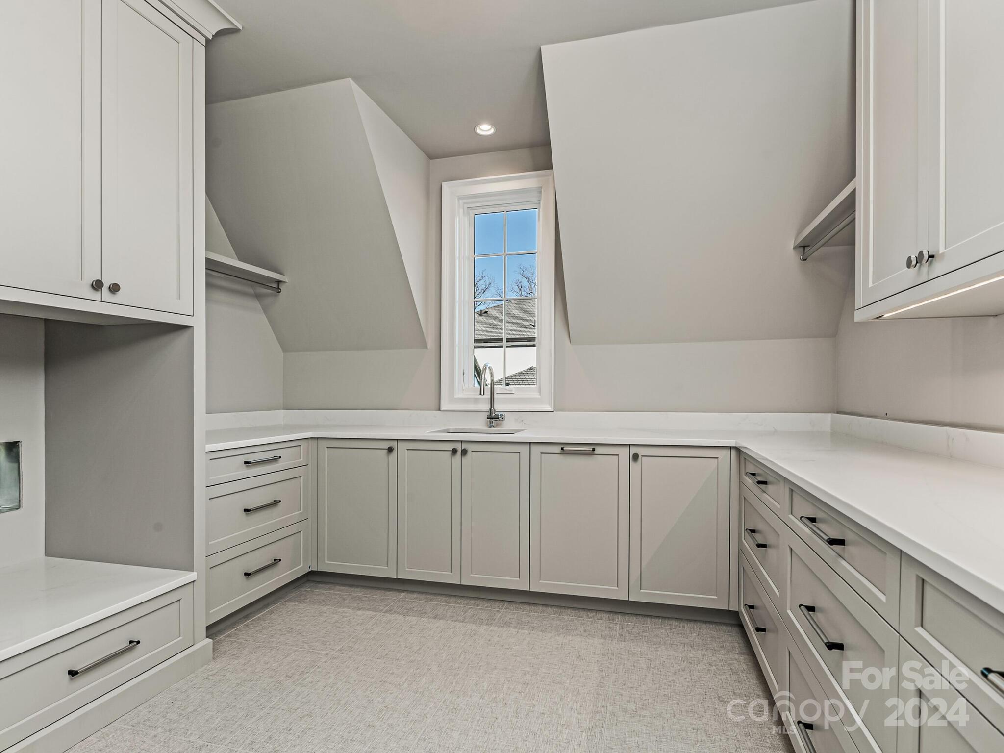 2215 Ferncliff Road Charlotte, NC 28211 - Photo 38 of 46 a kitchen with granite countertop white cabinets and white appliances
