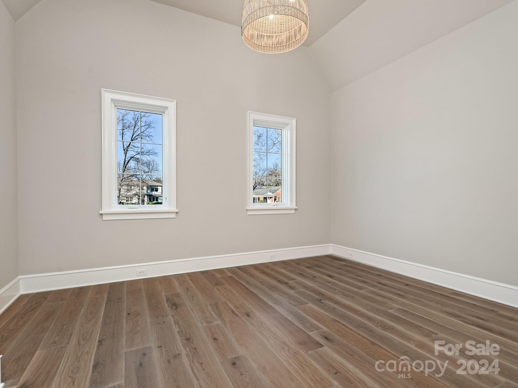 2215 Ferncliff Road Charlotte, NC 28211 - Photo 39 of 46 an empty room with wooden floor and windows