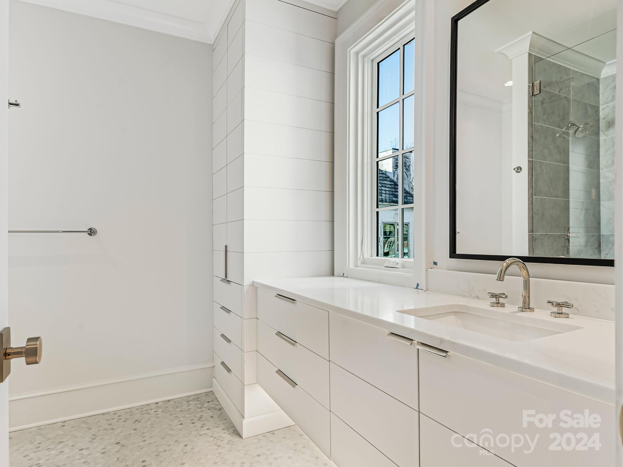 2215 Ferncliff Road Charlotte, NC 28211 - Photo 40 of 46 a bathroom with a sink and a mirror
