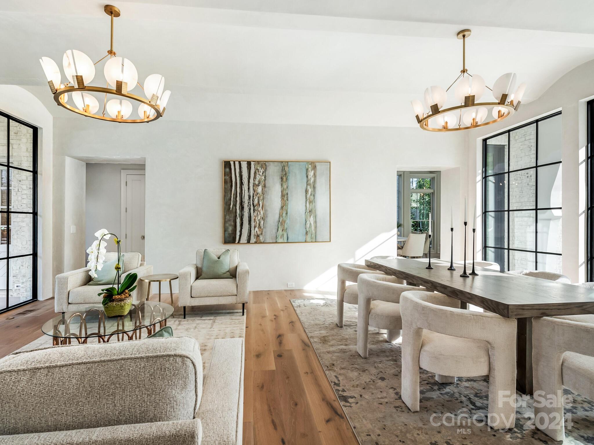 2215 Ferncliff Road Charlotte, NC 28211 - Photo 4 of 46 a view of a dining room with furniture wooden floor and chandelier