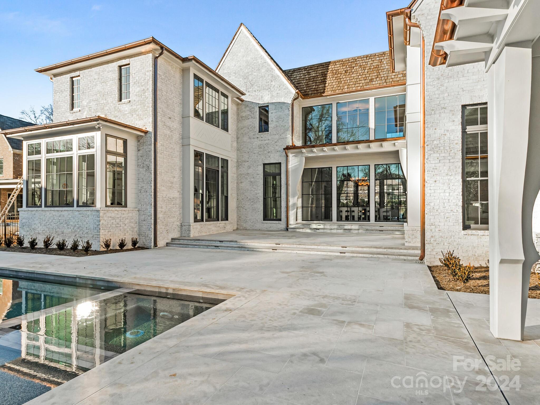 2215 Ferncliff Road Charlotte, NC 28211 - Photo 41 of 46 a view of a brick house with large windows