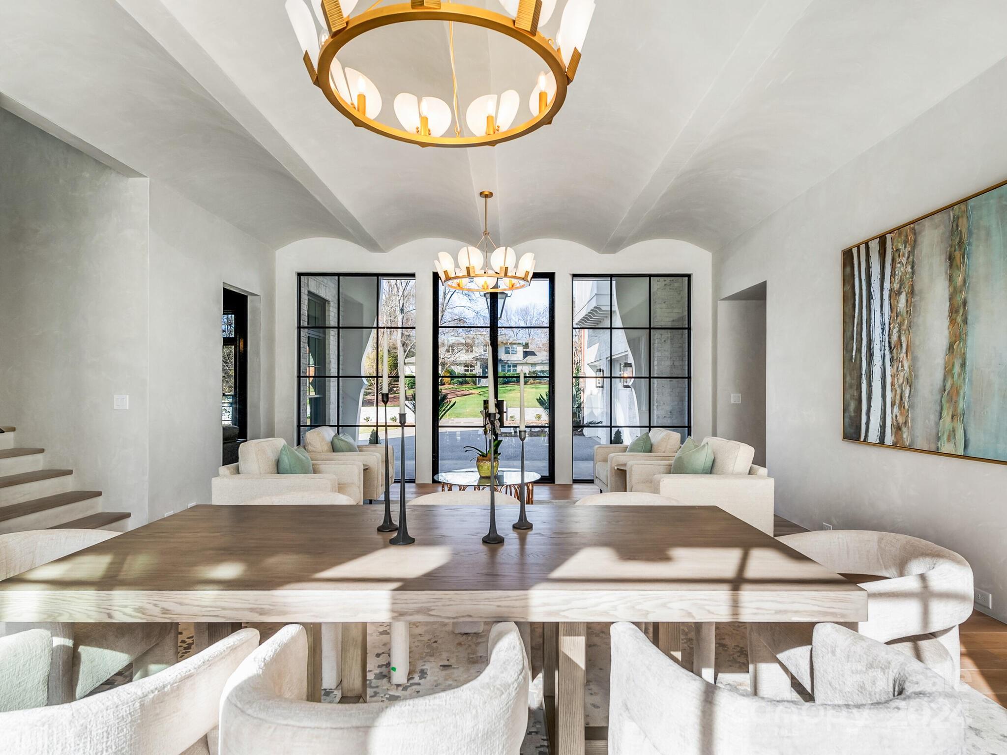 2215 Ferncliff Road Charlotte, NC 28211 - Photo 5 of 46 a view of a dining room with furniture wooden floor and chandelier