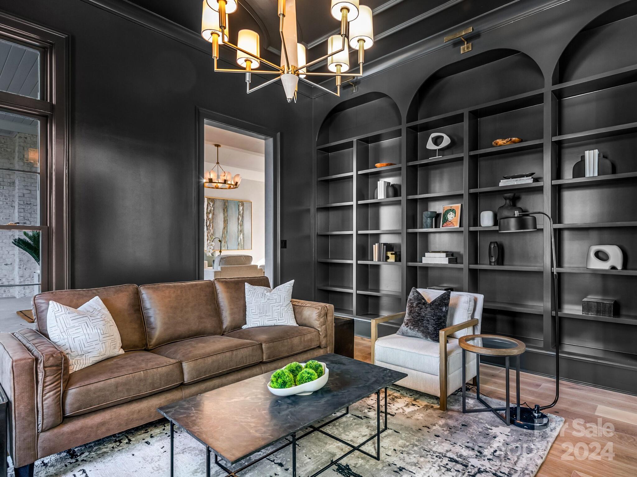 2215 Ferncliff Road Charlotte, NC 28211 - Photo 7 of 46 a living room with furniture a rug and a book shelf