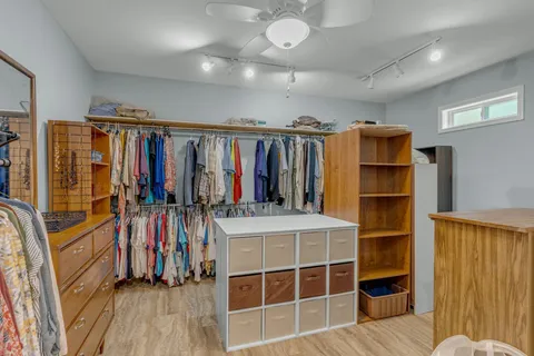 a aerial view of a house with a yard table and chairs
