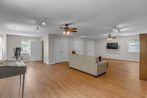 an aerial view of a house with a yard