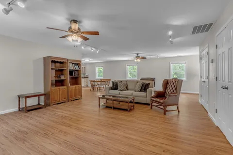 a aerial view of a house with a yard and outdoor seating