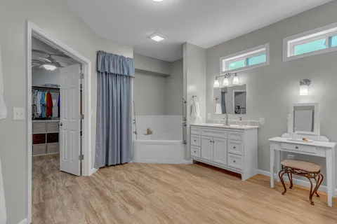 an aerial view of a house with a yard basket ball court and outdoor seating