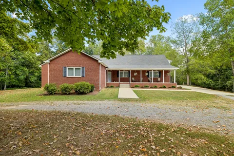 a bedroom with a bed and a table in it
