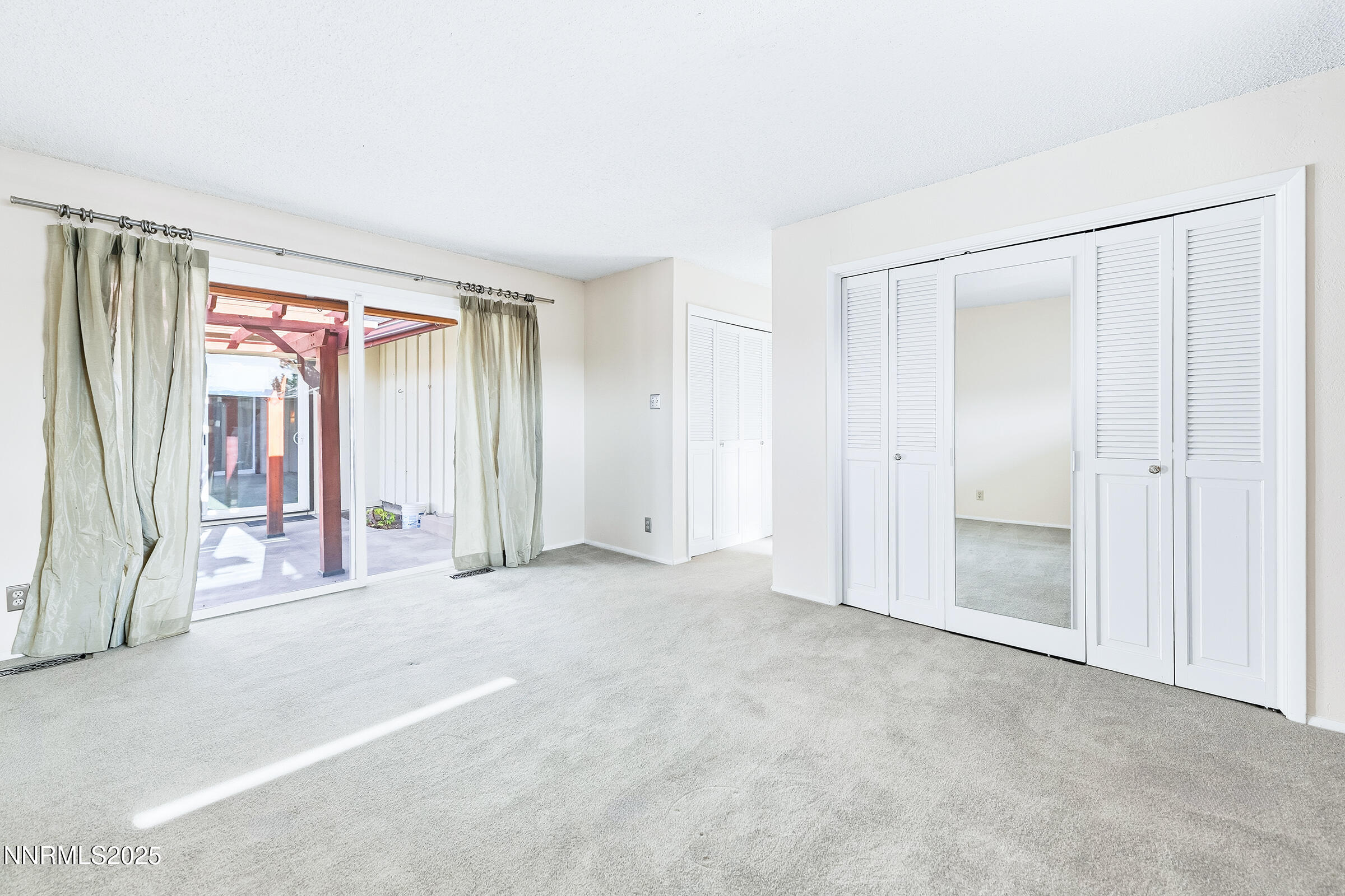 14535 Seminole Trail Reno, NV 89521 - Photo 12 of 25 an empty room with windows and door