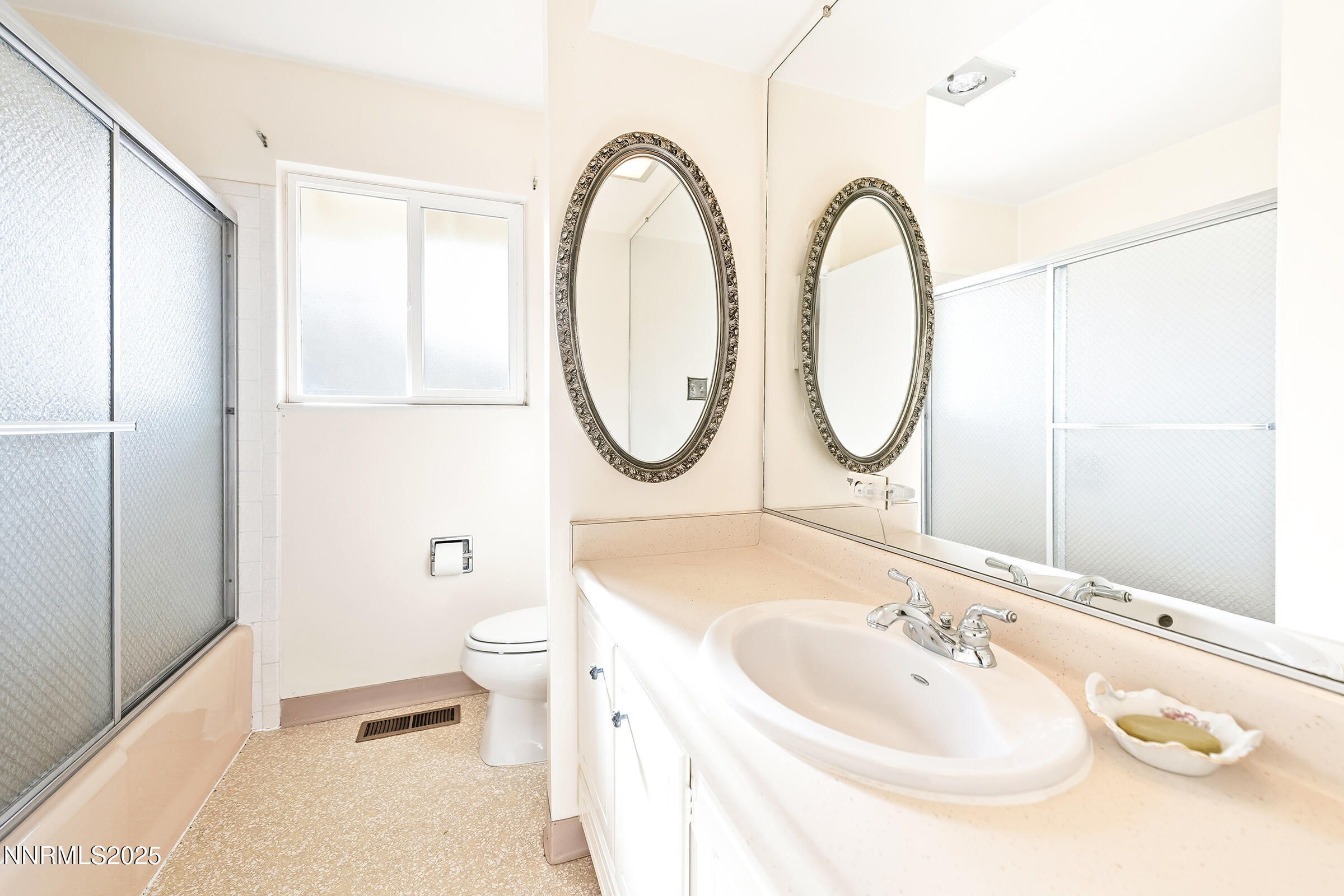 14535 Seminole Trail Reno, NV 89521 - Photo 19 of 25 a bathroom with a sink a toilet and a mirror
