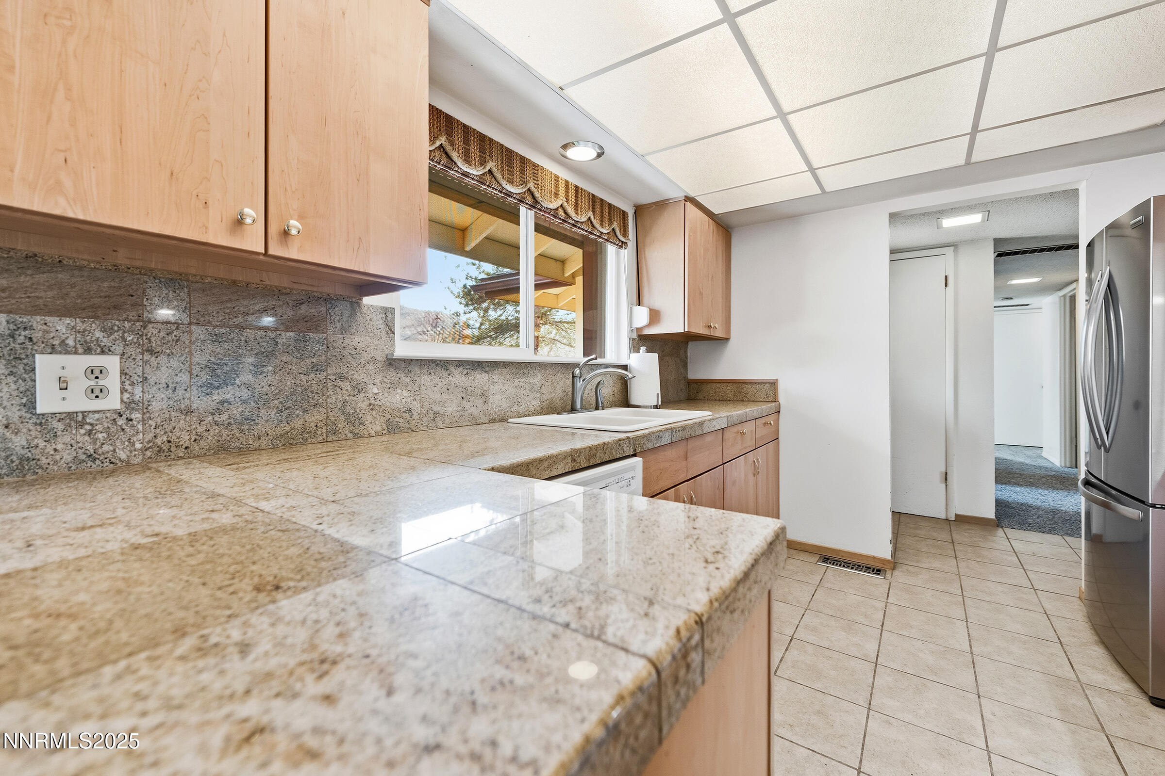 14535 Seminole Trail Reno, NV 89521 - Photo 8 of 25 a kitchen with stainless steel appliances granite countertop a sink stove and cabinets