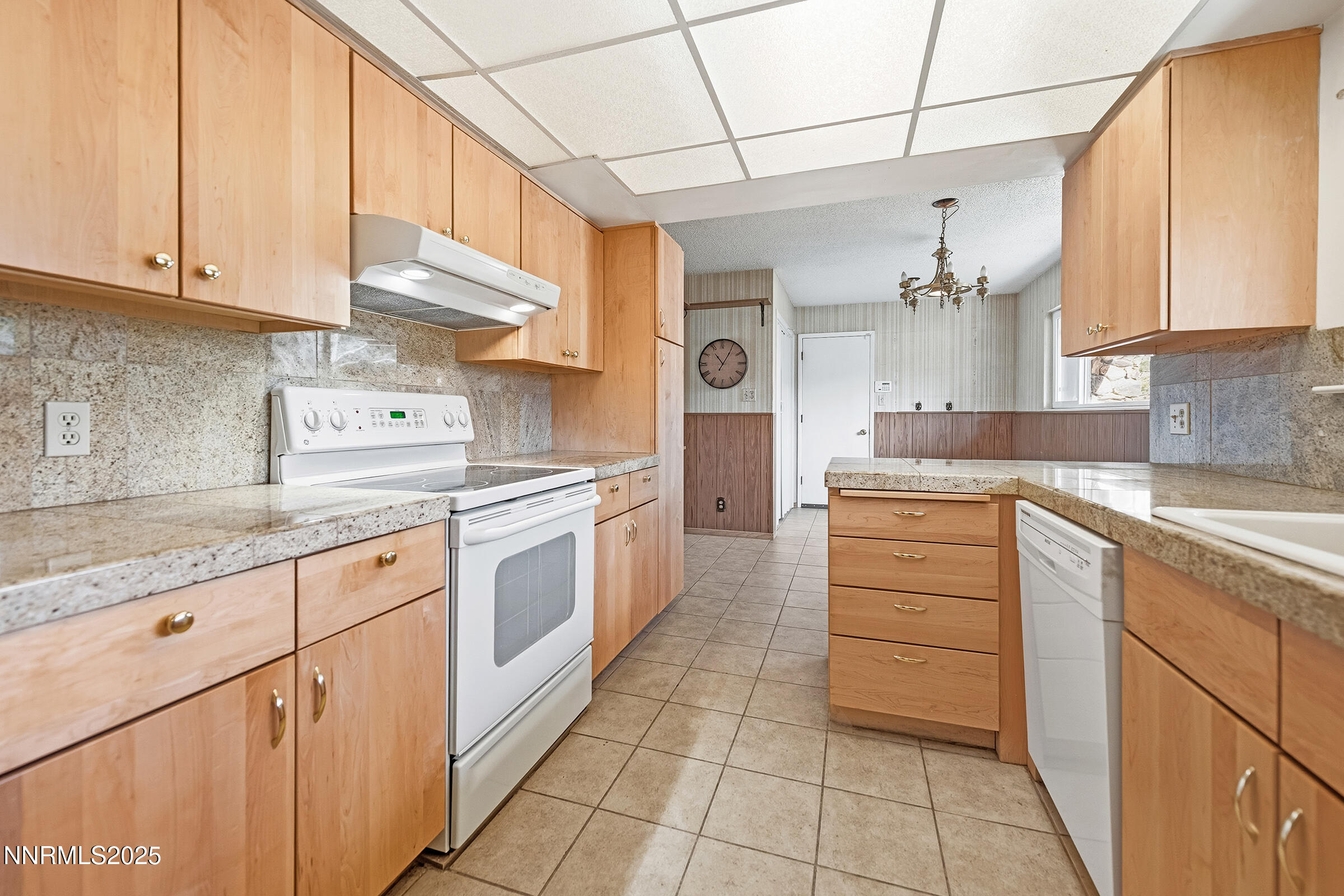 14535 Seminole Trail Reno, NV 89521 - Photo 9 of 25 a kitchen with a white cabinets and white appliances