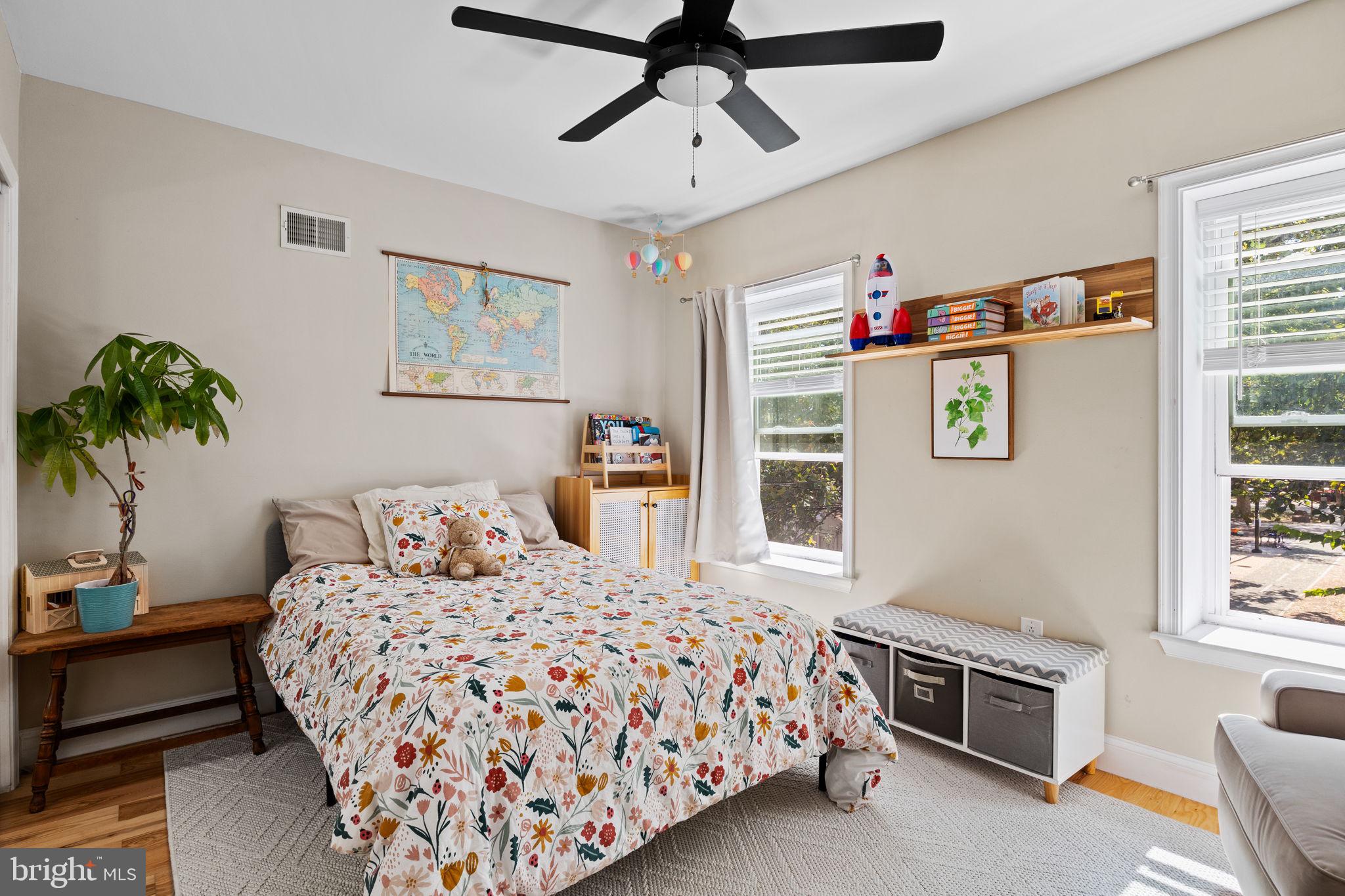 623 Manton Street Philadelphia, PA 19147 - Photo 12 of 26 a bedroom with a bed and a chandelier
