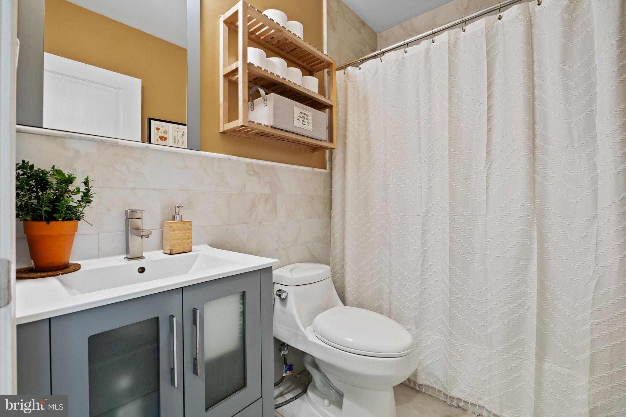 623 Manton Street Philadelphia, PA 19147 - Photo 14 of 26 a bathroom with a sink a toilet and shower