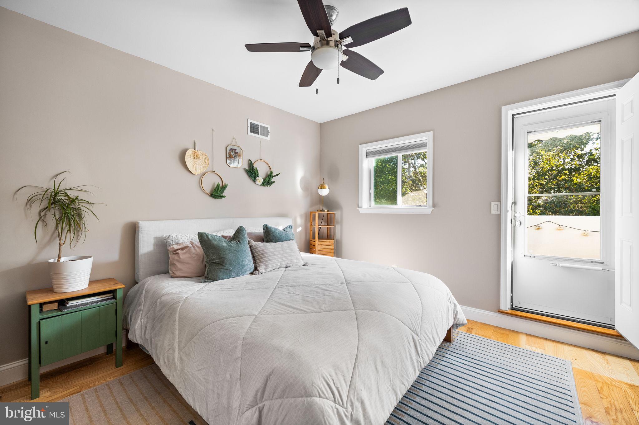 623 Manton Street Philadelphia, PA 19147 - Photo 15 of 26 a bedroom with a large bed and a chandelier