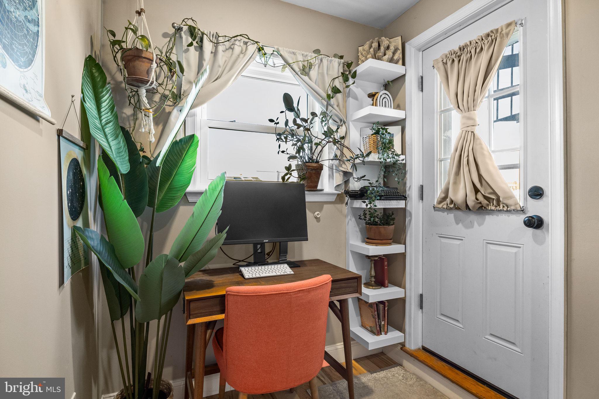 623 Manton Street Philadelphia, PA 19147 - Photo 19 of 26 a view of a workspace with furniture and a potted plant