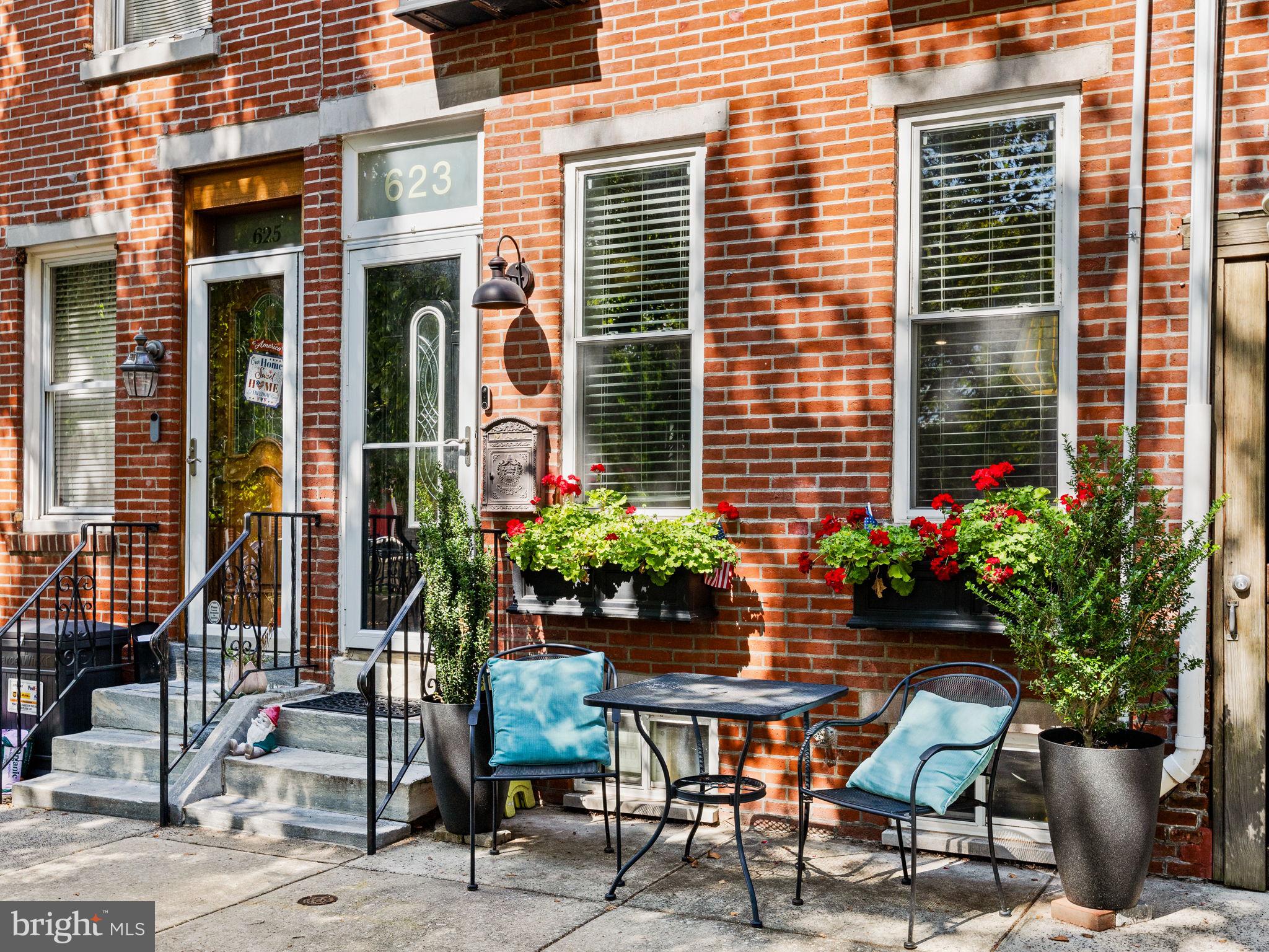 623 Manton Street Philadelphia, PA 19147 - Photo 2 of 26 a view of a patio with a table and chairs and potted plants