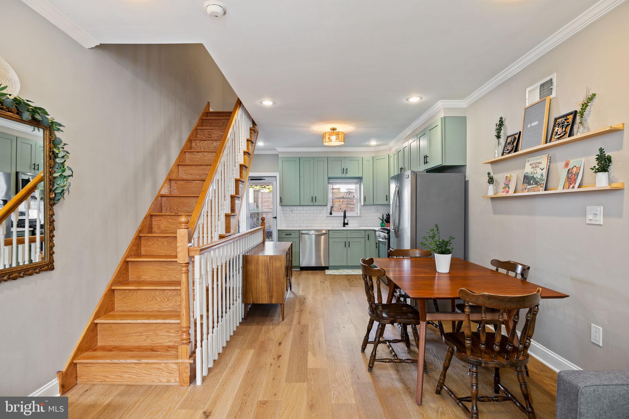 623 Manton Street Philadelphia, PA 19147 - Photo 6 of 26 a view of a dining room with furniture and stairs