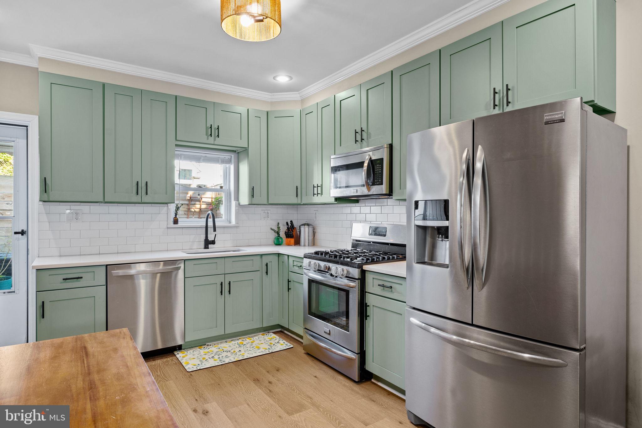 623 Manton Street Philadelphia, PA 19147 - Photo 7 of 26 a kitchen with a refrigerator sink and microwave