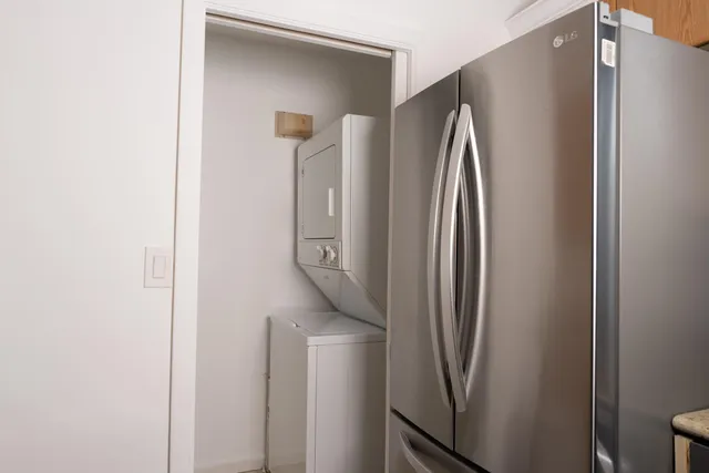 a kitchen with a sink cabinets and a window