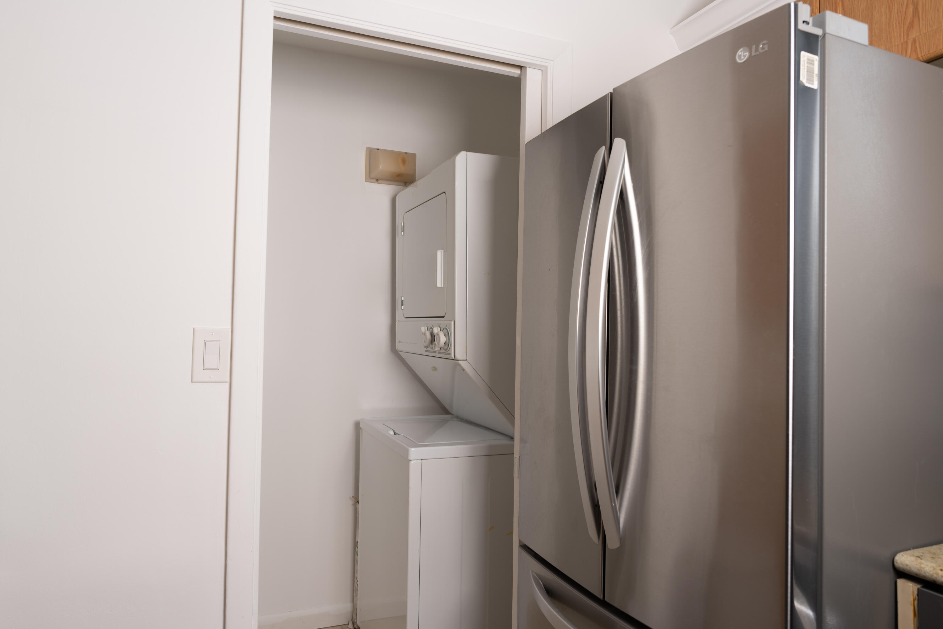 400 Ocean Trail Way, Unit 101 Jupiter, FL 33477 - Photo 22 of 60 a view of a refrigerator in kitchen