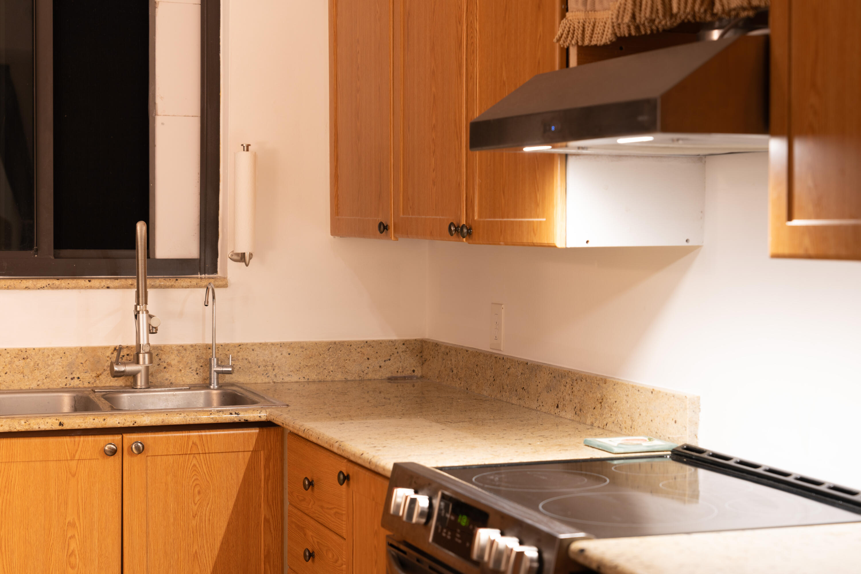 400 Ocean Trail Way, Unit 101 Jupiter, FL 33477 - Photo 28 of 60 a kitchen with a sink and a cabinets