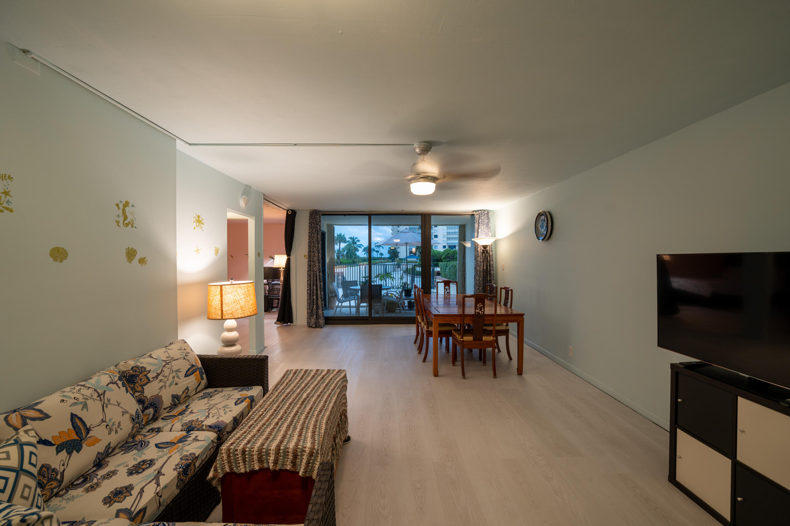 400 Ocean Trail Way, Unit 101 Jupiter, FL 33477 - Photo 33 of 60 a living room with furniture and a flat screen tv