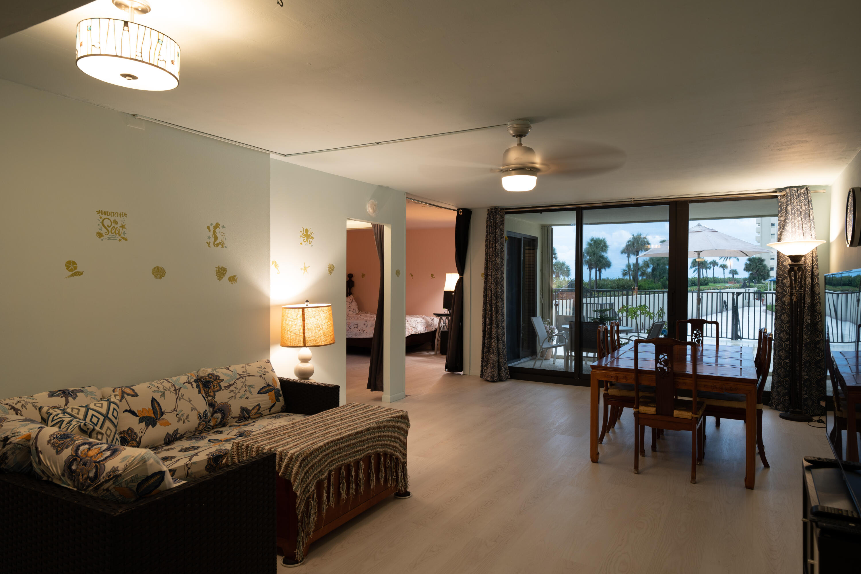 400 Ocean Trail Way, Unit 101 Jupiter, FL 33477 - Photo 34 of 60 a living room with furniture and a large window