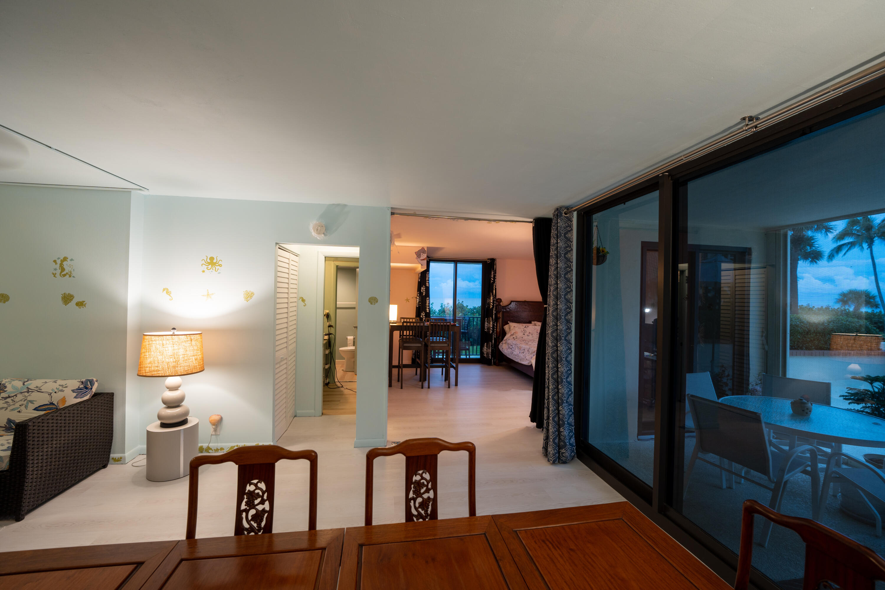 400 Ocean Trail Way, Unit 101 Jupiter, FL 33477 - Photo 35 of 60 a living room with fireplace furniture and a wooden floor