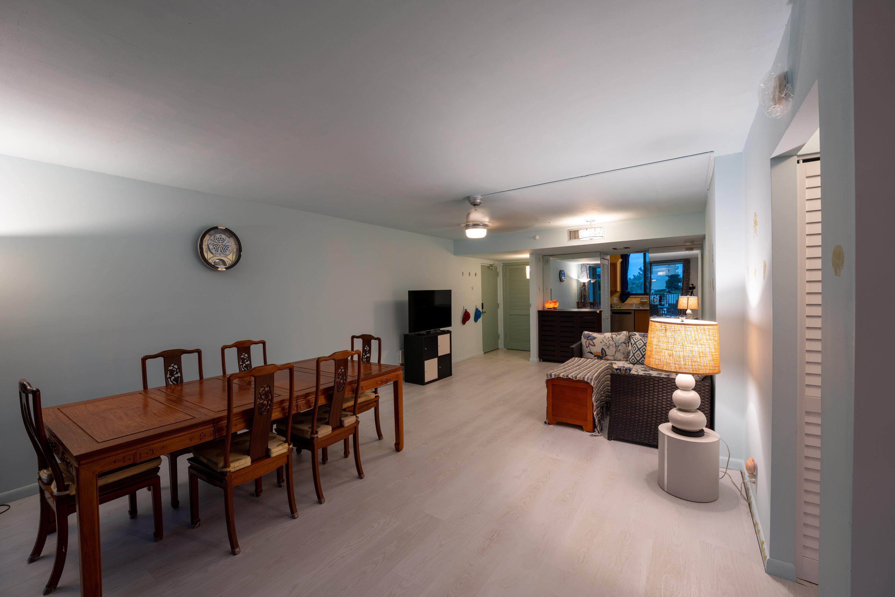 400 Ocean Trail Way, Unit 101 Jupiter, FL 33477 - Photo 36 of 60 a living room with furniture and a dining table with chairs