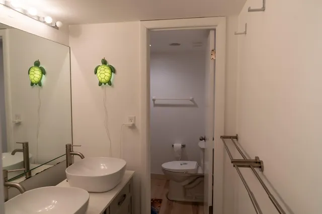 a kitchen with a sink appliances and cabinets