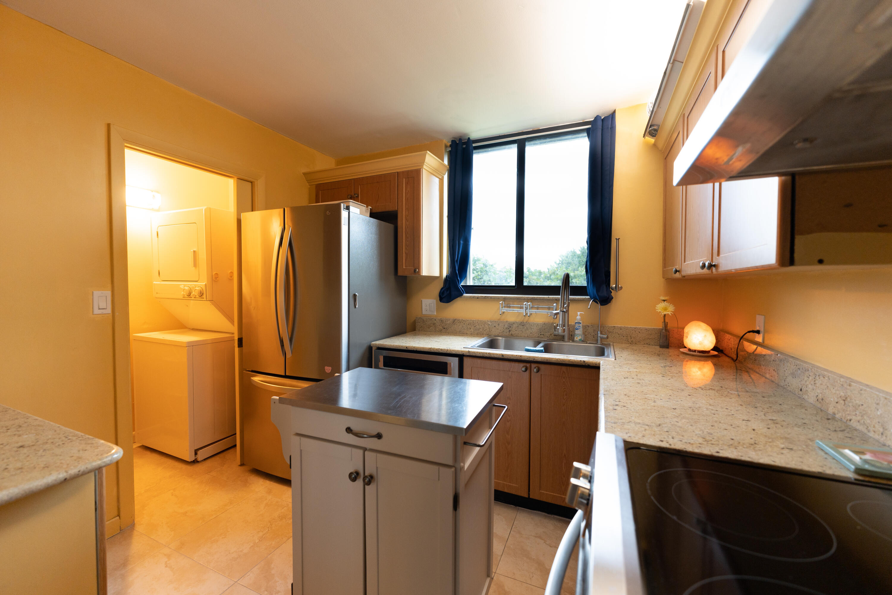 400 Ocean Trail Way, Unit 101 Jupiter, FL 33477 - Photo 40 of 60 a kitchen with a sink appliances and cabinets