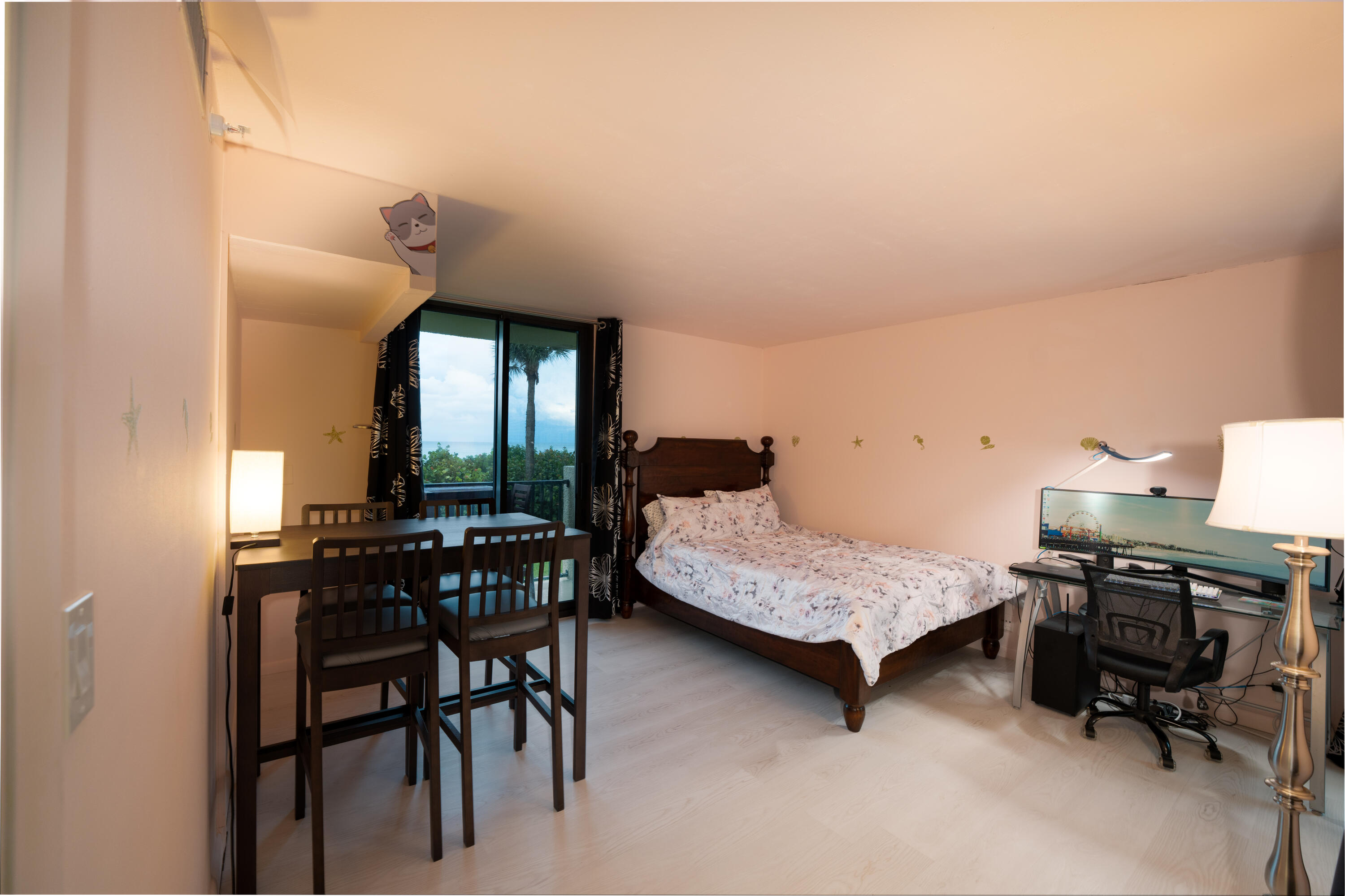 400 Ocean Trail Way, Unit 101 Jupiter, FL 33477 - Photo 45 of 60 a bedroom with furniture and a window
