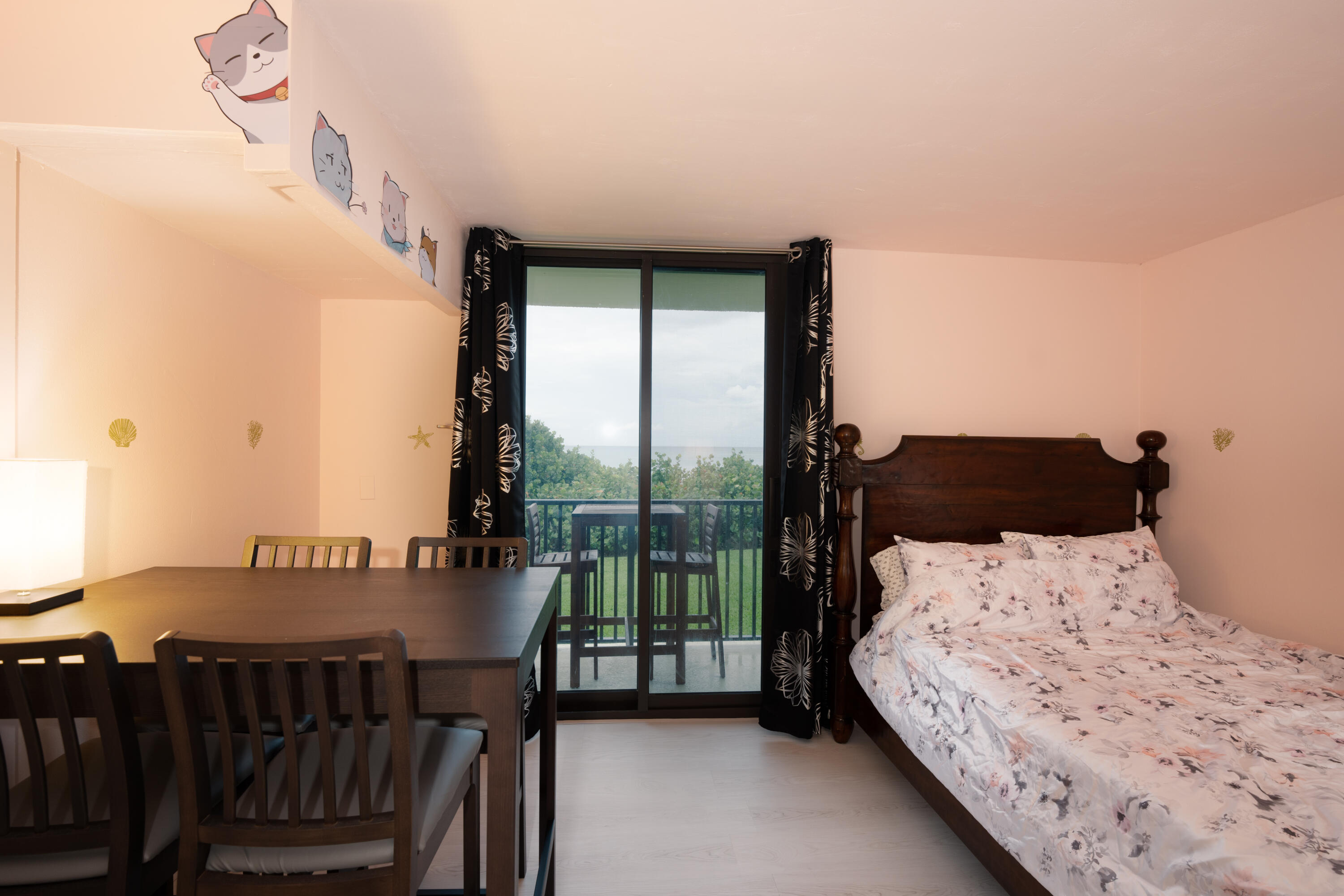 400 Ocean Trail Way, Unit 101 Jupiter, FL 33477 - Photo 46 of 60 a bedroom with a bed and a window