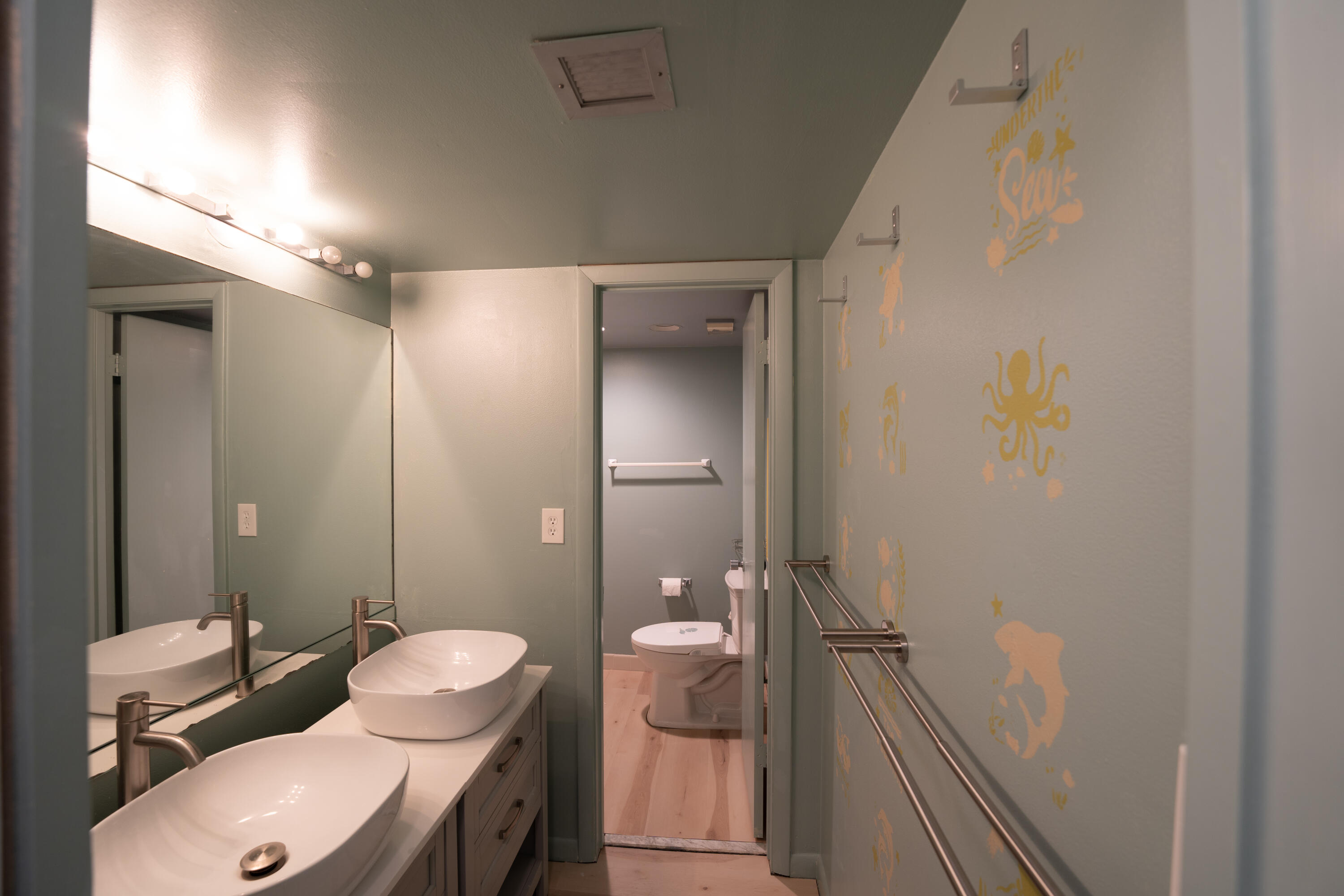 400 Ocean Trail Way, Unit 101 Jupiter, FL 33477 - Photo 47 of 60 a bathroom with a sink and toilet