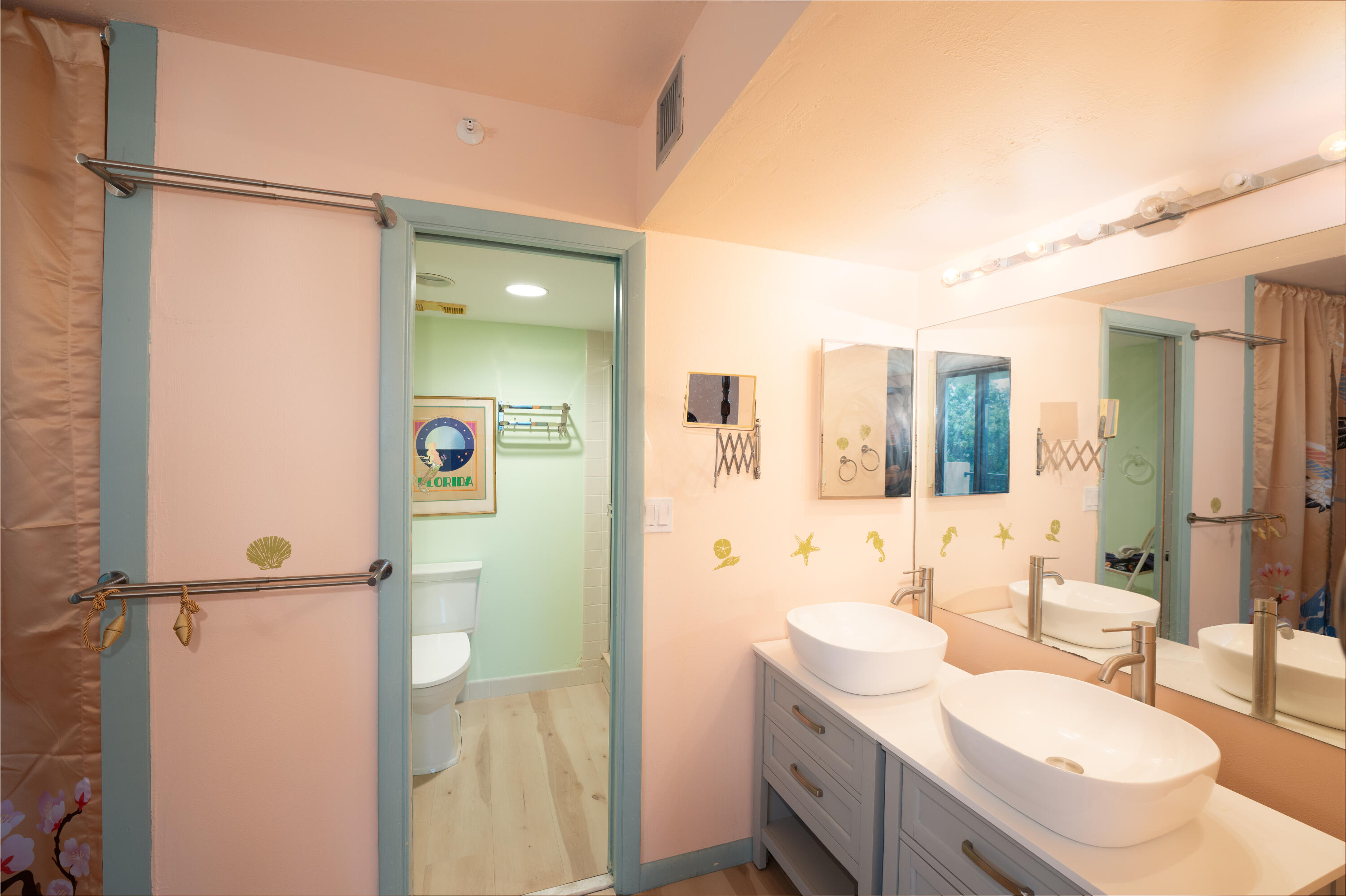 400 Ocean Trail Way, Unit 101 Jupiter, FL 33477 - Photo 56 of 60 a bathroom with a sink and mirror