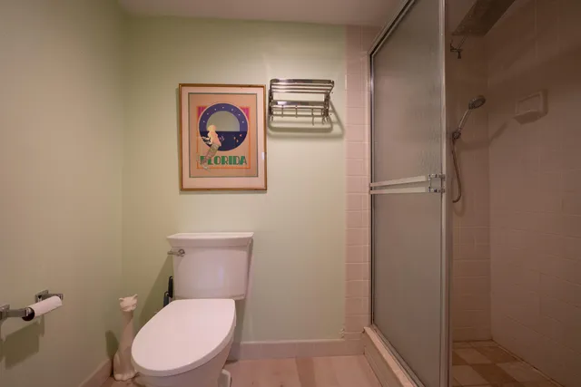 a bedroom with furniture and a flat screen tv