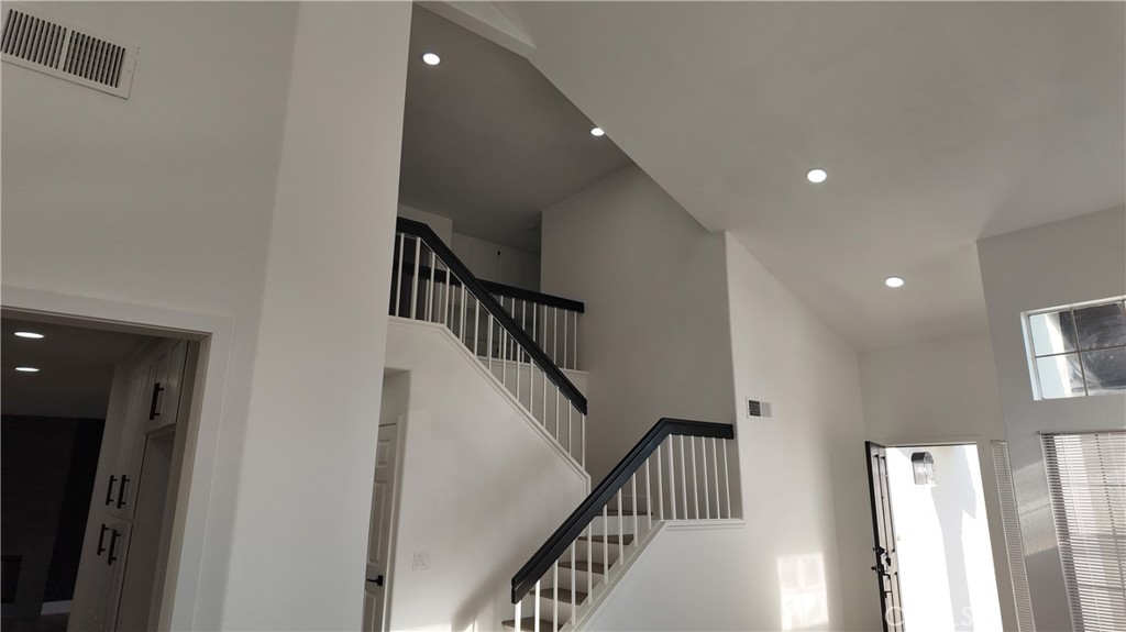 21484 Dickinson Road Moreno Valley, CA 92557 - Photo 2 of 10 a view of staircase with wooden floor and stairs