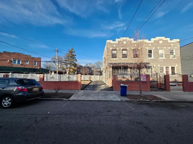 a view of street with parked cars