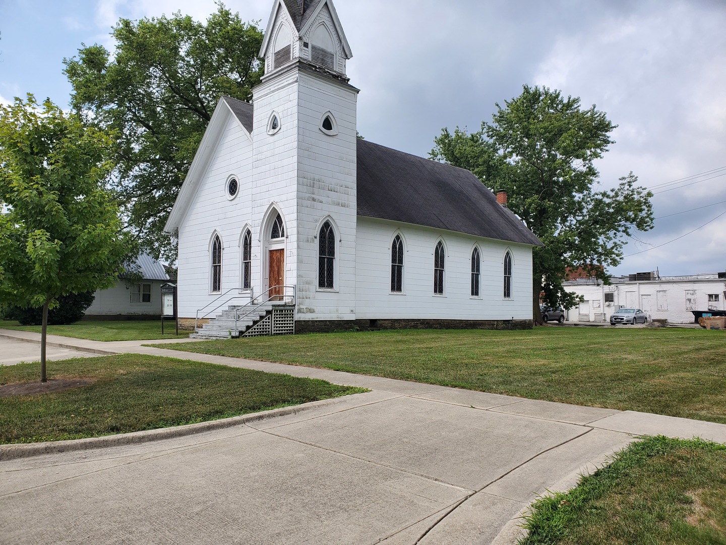 116 North Main Street Gilman, IL 60938 - Photo 2 of 18 a view of a white house with a yard